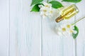 Photo of jasmine oil. Jasmine flowers and oil. Photo cosmetology and spa Royalty Free Stock Photo