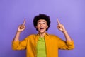 Photo of joyful glad nice man wear trendy clothes looking empty space special autumn sale offer isolated on violet color
