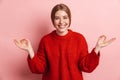 Photo of joyful nice woman laughing and holding fingers together