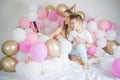 Photo of joyful woman with kid boy smiling and taking selfie photo on cellphone  with balloon. Birthday party Royalty Free Stock Photo