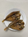 Photo of Katambak or Dried Sweetlip Emperor Fish on Plate Filipino Dish Royalty Free Stock Photo