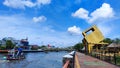 Photo of a ketupat village with a view of a ship traveling along the Martapura river, Banjarmasin, South Kalimantan