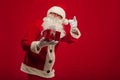 Photo of kind Santa Claus giving xmas present and looking at cam Royalty Free Stock Photo