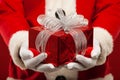 Photo of kind Santa Claus giving xmas present and Royalty Free Stock Photo