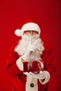 Photo of kind Santa Claus giving xmas present and Royalty Free Stock Photo