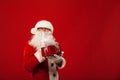 Photo of kind Santa Claus giving xmas present and Royalty Free Stock Photo