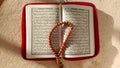 Photo of the Koran and prayer beads which are symbols of Islam