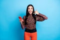 Photo of lady hold telephone ask call back toothy smile wear floral print shirt isolated blue color background