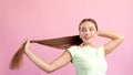 Photo of lady visit beautician hold her haircut enjoy growth length silky wellness isolated over pastel color background