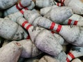 Photo of a large pile of very dirty bowling pins of Twister brand