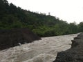 photo of a large river with views of mountains and forests