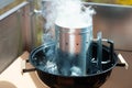 A photo of a starter bbq during the ignition of a flame for a gr