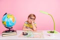 Photo of little bored unhappy boy hand face look empty space science lesson isolated on pink color background