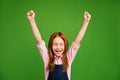 Photo of little crazy ginger schoolchild in front of blackboard celebrating raise fists rejoicing summer beginning wear