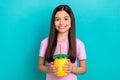 Photo of little kid girl pink t-shirt hold pineapple tropical cocktail drinking summer vacation beverage isolated on Royalty Free Stock Photo