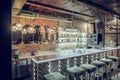 Photo of loft bar brick interior being decorated with lighting Royalty Free Stock Photo