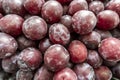 Photo of a lot of plums on the counter of the store Royalty Free Stock Photo