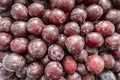 photo of a lot of plums on the counter of the store Royalty Free Stock Photo