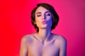 Photo of lovely brunette hairdo young lady closed eyes blow kiss isolated on vibrant neon red color background