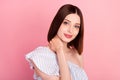 Photo of lovely brunette young lady hand neck wear white top  on pink color background Royalty Free Stock Photo