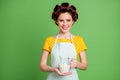 Photo of lovely cute young hospitable girl roller hairstyle beaming smiling hold jar give cold fresh milk tired traveler Royalty Free Stock Photo