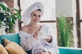 Photo of lovely lady relax after bath shower with hydration beauty product drink espresso in living room Royalty Free Stock Photo