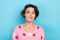 Photo of lovely pretty adorable girl wear pink trendy print outfit bite lips grimace oops sorry isolated on blue color