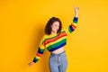 Photo of lovely young girl direct forefinger up eyes closed dance wear striped cropped pullover jeans isolated yellow Royalty Free Stock Photo