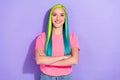 Photo of lovely youngster lady with teal yellow hairdo colors cross arms isolated over violet background