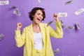 Photo of lucky lottery winner girl raise fists up screaming her huge jackpot falling dollars banknotes isolated on Royalty Free Stock Photo