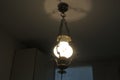 Luster chandelier with a bulb turned on