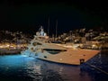 Photo of luxury yacht docked in picturesque port and main village of Hydra or Ydra island with beautiful neoclassic houses, Royalty Free Stock Photo