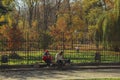 Photo of Lviv city in autumn season with people sitting on bench Royalty Free Stock Photo