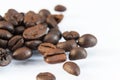 Photo macro coffee beans on a white background. Royalty Free Stock Photo