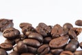 Photo macro coffee beans on a white background. Royalty Free Stock Photo