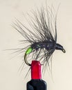 Macro shot of fly fishing lure on a black background, hand made fly for fishing Royalty Free Stock Photo