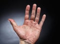 Picture of male dirty palm on black background