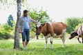 Male farmer checking on his herd on his farm