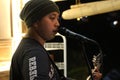 photo of a male guitarist being live in a cafe