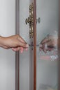 Photo of male hand putting cabinet key into front door lock of c Royalty Free Stock Photo