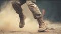 Photo of male Navajo military soldier kicking rock, focus on boot covered in dust.