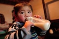 A child drinking a bottle milk Royalty Free Stock Photo