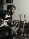 Man playing his electric guitar in a music studio Royalty Free Stock Photo