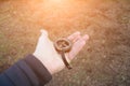 Photo of man`s hand with vintage compass