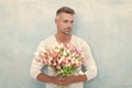 photo of man with valentine flowers for holiday. man with valentine flowers.