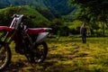 Man walking away from dirt bike in Guatemalan mountains