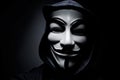 Photo of man wearing Vendetta mask. This mask is a well-known symbol for the online hacktivist group Anonymous.