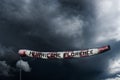 Photo manipulated image of a extra long windsock showing the power of Hurricane Florence.