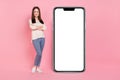 Photo of marketer lady presenting offer large big telephone touchscreen panel new design device isolated pink color