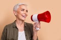 Photo of mature age activist ecology supporter woman holding megaphone screaming stop rising temperature isolated on Royalty Free Stock Photo